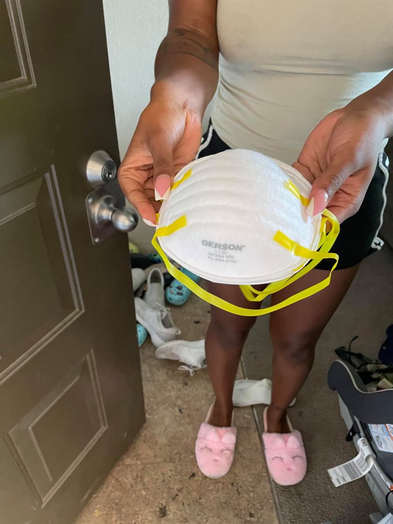 Hands holding N95 masks from HelpSierraBreathe